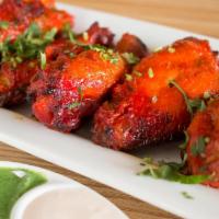 Tandoori Wings 'Desi' Style (Six Pieces) · Chicken party wings marinated in special ‘Tandoori’ sauce, grilled in clay ‘Tandoori’ oven, ...