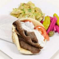 17. Gyro Meat Wrap · Served with pickled turnips and a choice of spicy potatoes or a house salad.