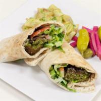 18. Falafel Wrap · Served with pickled turnips and a choice of spicy potatoes or a house salad. Vegetarian.