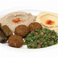 12. Vegetarian Platter · Served with homemade hummus, house salad, pita bread and famous green sauce. Vegetarian.