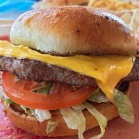 Cheeseburger · Grilled bun, cheese, lettuce, tomato, onion, mustard and ketchup. Made with 100% all Angus b...