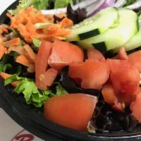 Garden Salad · Fresh Salad Greens, Cucumber, Tomatoes, Carrots, and dressing of your choice: