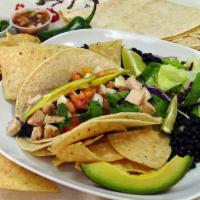 Taco Grandissimo · Choice of meat, corn tortillas, avocado, beans, salsa and cilantro.