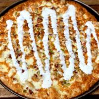 Phantom Ranch Pizza · White pizza with grilled chicken, bacon, hot peppers, and ranch dressing.