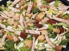 Chicken Caesar Salad · Grilled chicken breast on our mix of romaine and iceberg lettuce, with Parmesan cheese, chop...