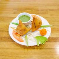 2 Samosa · Dough pockets filled with potato and vegetable mix.