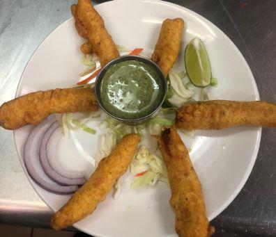Paneer Pakora · Thinly-sliced paneer (cheese) battered with chick-pea flour and spices and deep fried. A very popular Indian vegetarian snack.