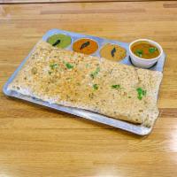 Rava Dosa · Crispy Rice/Semolina mix crepe served with chutneys and sambar