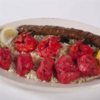 Mixed Tandoori Grill · Chicken tikka, tandoori shrimp and malai seekh kebab served on rice. Served with rice and yo...