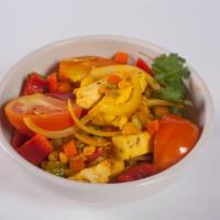 Vegetarian Jalfrazie · Pieces of our own fresh paneer cheese, sauteed with bell peppers, tomatoes, corn, carrots, p...