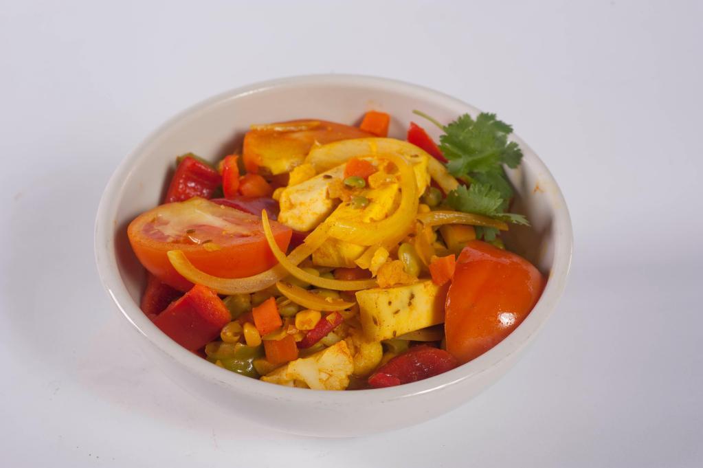 Vegetarian Jalfrazie · Pieces of our own fresh paneer cheese, sauteed with bell peppers, tomatoes, corn, carrots, peas, onions and sprinkled with mild spices. Served with rice and choice of soup or salad.