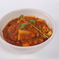 Vegetable Curry · Potatoes, eggplant, cauliflower and peas cooked in a mild sauce. Served with rice and choice...