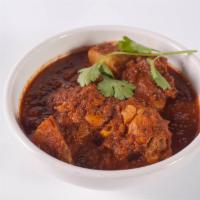 Chicken Vindaloo · Highly spiced chicken cooked in a lightly sour and spicy sauce.
