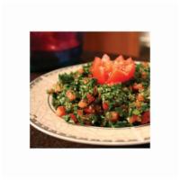 Tabouleh Salad · Chopped parsley, diced tomatoes, diced onions and cracked wheat dressed with spices, lemon j...