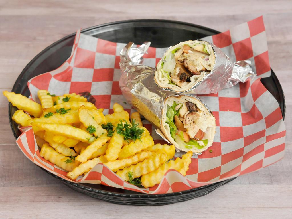 Chicken Shawarma Sandwich · Thin slices of marinated chicken cooked on a slow revolving rotisserie. Served in a pita packet with lettuce, tomatoes, onions, banana peppers and pickles.