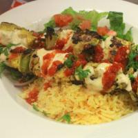 Chicken Shish Kabob · Served with basmati rice, green house salad, pita bread and sauce.