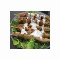Kofta Kebab Plate · Served with basmati rice, green house salad, pita bread and sauce.