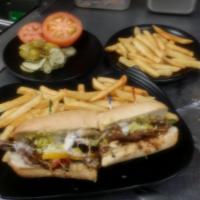 Hot Philly Cheese Steak Sub · Seasoned beef, grilled onions and bell peppers, and topped with provolone cheese and peppero...