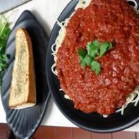 Spaghetti with Meat Sauce · Generous portion of spaghetti with marinara meat sauce and grated mozzarella. Served with ga...