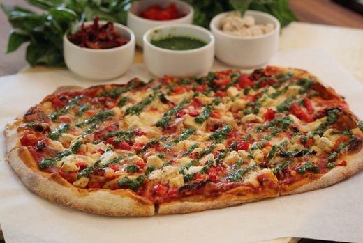 Pesto Chicken Pizza · Chicken, tomatoes, mushrooms, onion, fresh garlic, mozzarella cheese and pesto sauce.