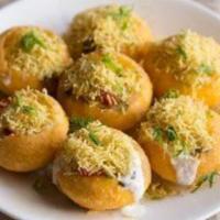 8 Pieces Sev Puri · Street style must try. Puffed puris filled with potatoes, chickpeas topped with yogurt and t...