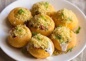 8 Pieces Sev Puri · Street style must try. Puffed puris filled with potatoes, chickpeas topped with yogurt and tamarind sauce. Vegetarian.
