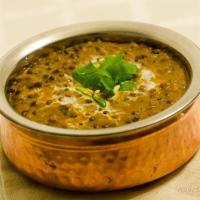 Dal Makhani · Lentils simmered for hours with herbs and spices, then tempered with butter. Vegetarian.