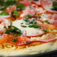 Caprese Pizza · Pizza sauce, fresh tomatoes, fresh mozzarella, fresh basil and extra virgin olive oil.