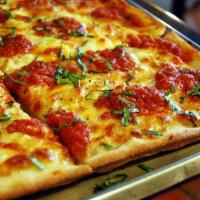 Nona's Palermo Pizza · Slices of fresh mozzarella, marinara sauce, garlic, herbs and Pecorino Romano. Thin square p...