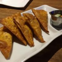 Crab Rangoon · Deep fried wonton skin filled with cream cheese and crab stick.