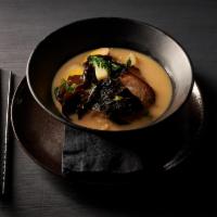 Tonkotsu Ramen · Handcrafted noodles in pork base broth topped with chaslu pork, scallion, fish cake, bok cho...