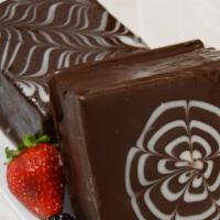 Chocolate Cake · 2 thick layers of moist chocolate cake, creamy chocolate mousse in the middle, coated with a...