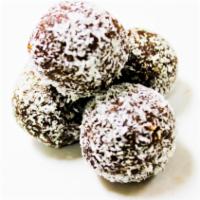 Rum Balls · Chocolate bowls made with a mix of nuts and dark Swedish chocolate covered with coconut.
