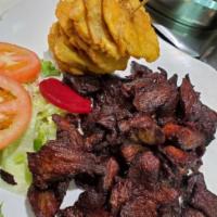 Carnitas Fritas Estilo Dominica · Fried steak strips.