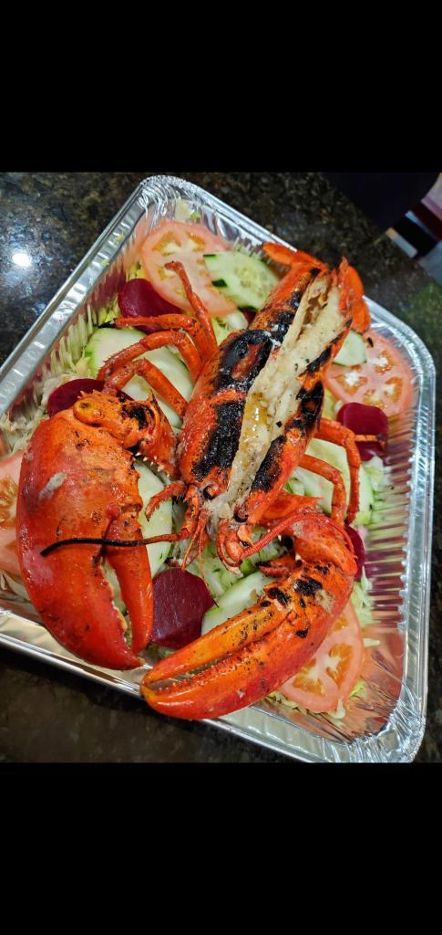 Langosta al Ajillo · Lobster in garlic butter sauce.