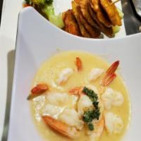 Camarones al Ajillo · Grilled shrimp in garlic butter sauce.