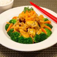 Orange Chicken · Crispy fried chicken tossed in orange sauce served with steam broccoli, and carrots.