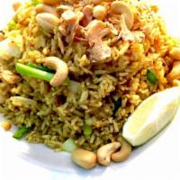 Yellow Curry Fried Rice · Fried rice with yellow curry powder, eggs, raisins, cashews, onions and green onions topped ...
