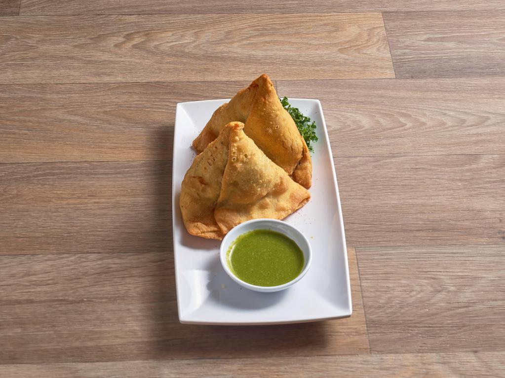 2 Piece Vegetable Samosa · 2 pieces. Triangle shaped pastry stuffed with peas, potatoes, onions and spices.