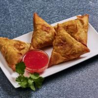 A1. 4 Piece Samosas · Hand wrapped and filled with curried potatoes, red onions, peas and carrots. Deep fried and ...