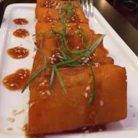 A3. Shan Tofu · Homemade tofu made with fresh yellow beans. Crisp on the outside with a silken center. Serve...