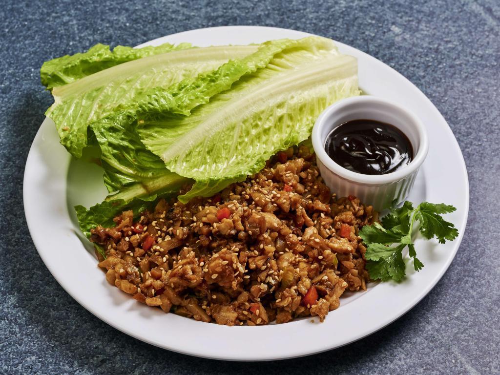 A4. Lettuce Wrap · Crisp lettuce leaves with chicken or five spice tofu with shiitake mushrooms, radish, carrots and water chestnuts.