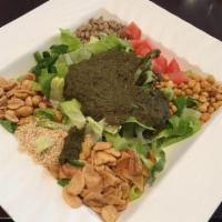 B1. Tea Leaf Salad · With romaine lettuce, fried yellow beans, fried garlic, sesame seeds, peanuts, sunflower see...