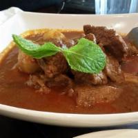 G7. Burmese Curry Beef · Braised until tender with potatoes. Topped with cilantro.