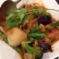 J6. Burmese Vegetable Curry · Made with tomatoes, squash, potatoes, eggplant, carrots, lentils, okra, tofu and mint. Veget...
