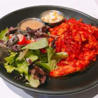 Spicy Chicken Over Rice · Chicken mixed and tossed in korean hot sauce with assorted vegetables. Served with white rice.