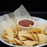 Chips and Salsa · Fresh house made crispy corn chips (seasoned or plain) and 3 salsas: roasted tomato, warm sa...