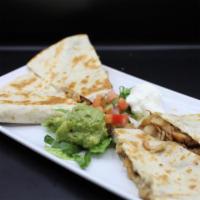 Quesadilla · Flour tortilla with melted cheese your choice of meat, garnished with sour cream, guacamole ...
