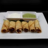Taquitos Jalisco · Crispy hand rolled chicken, beef or potato corn rolls topped with salsa, Cotija cheese, chop...