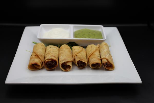 Taquitos Jalisco · Crispy hand rolled chicken, beef or potato corn rolls topped with salsa, Cotija cheese, chopped lettuce, sour cream, pico de gallo, lime onions  and avocado sauce. Try them birria style for an additional charge. Add non dairy cheese and sour cream for an additional charge. Plant based friendly.